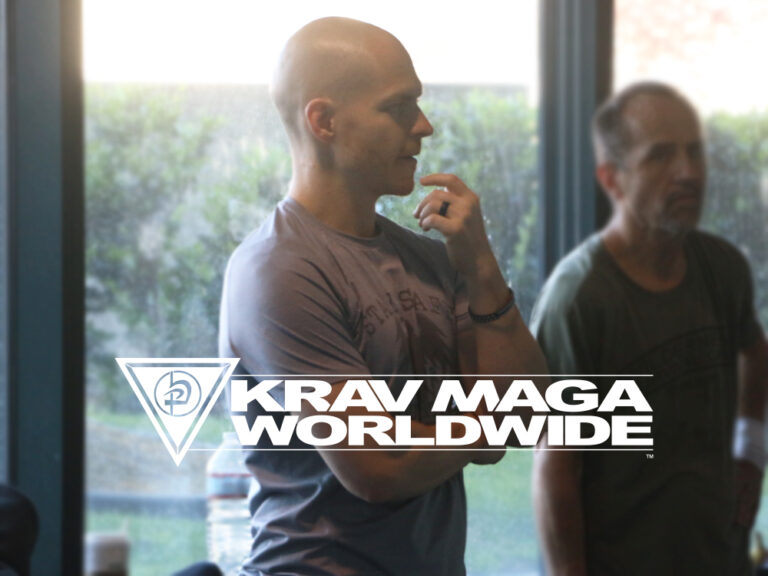 Man looking curious and asking questions about Krav Maga moves during Krav Maga self-defense class.